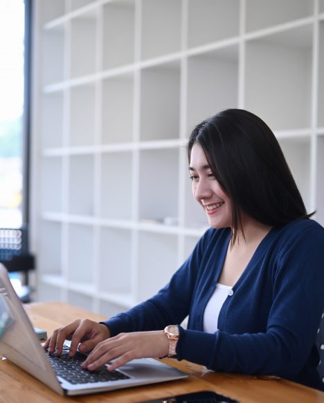 Hispanic female studying at computer | New Students