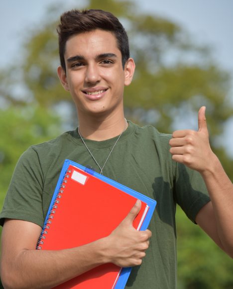 Hispanic male student with dogtags