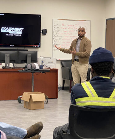 Mike Agnew, general manager of Equipment Depot, left, and Matthew Hosein, a regional product support director for Equipment Depot, discuss their company with Diesel Equipment Technology students at TSTC during a recent employer spotlight event.