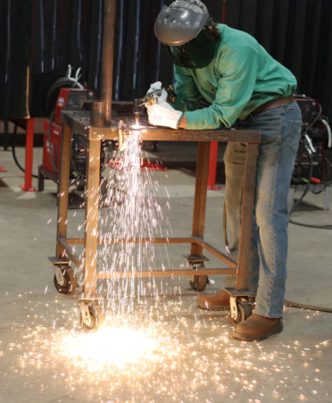 A high school welding student works on a project as part of the District 9 SkillsUSA regional competition, hosted on TSTC’s Fort Bend County campus.