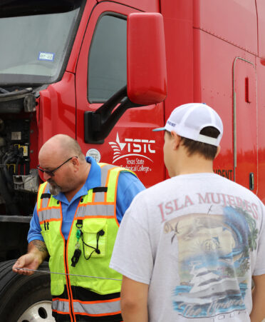 TSTC CDL trainer Paul Hildebrandt, second from left, leads a recent training session.