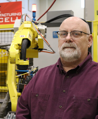 TSTC Robotics Technology instructor Charles Sparks brings extensive industry experience to the lab for students to learn from.