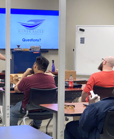 John Farley, fleet supervisor for Silver Eagle Houston’s Pasadena branch, answers questions from TSTC Diesel Equipment Technology students during an employer spotlight event. Farley is a TSTC graduate.