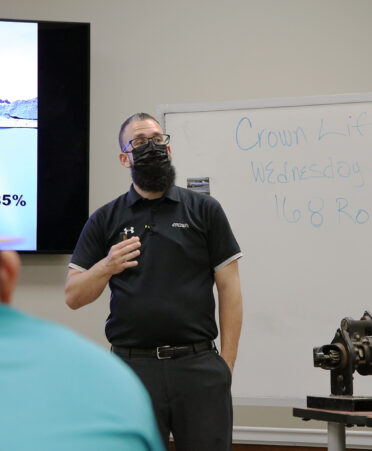 Joe Razza, a regional recruiter for Crown Equipment, talks with TSTC Diesel Equipment Technology and Industrial Systems students during a recent event at TSTC’s Fort Bend County campus.