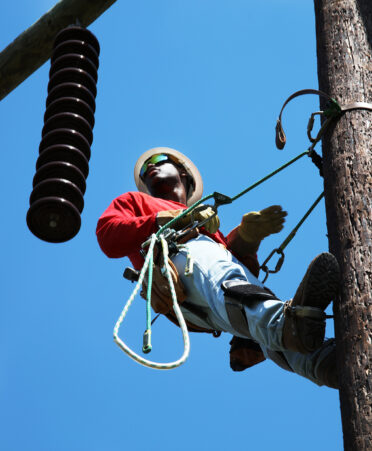 TSTC Electrical Lineworker Technology student DaVyion Ellis demonstrates his climbing skills in the pole yard at TSTC’s Fort Bend County campus.