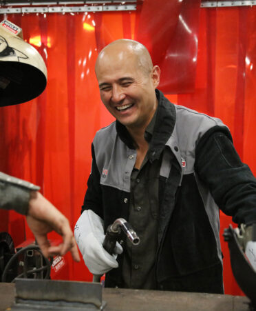 Texas state Rep. Jacey Jetton (R-Richmond), right, laughs as Texas State Technical College Welding Technology instructor Alex Deibert assesses the welding job that Jetton completed during a visit Thursday, July 14, 2022, to TSTC’s campus in Fort Bend County.