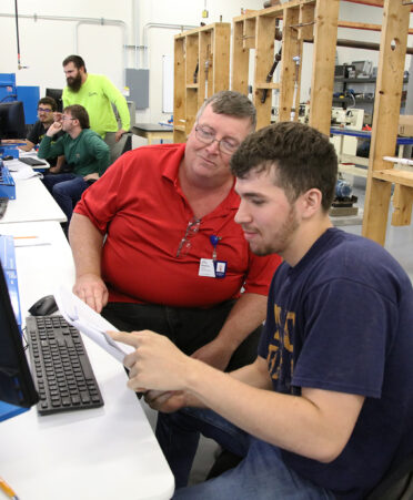 TSTC Industrial Systems instructor Brian Weakley, second from right, leverages his decades of industry experience to give students knowledge that they cannot get from a textbook.