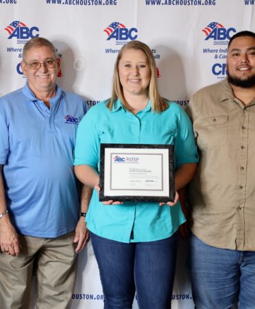 TSTC Occupational Safety and Environmental Compliance graduate Annabelle Simons, center, holds a STEP Platinum Safety Management System award that she received for her work at Locke Solutions. Pictured with her are Michael Luck, second from left, Locke Solutions vice president, and Chris Coronado, second from right, Locke Solutions plant engineer.