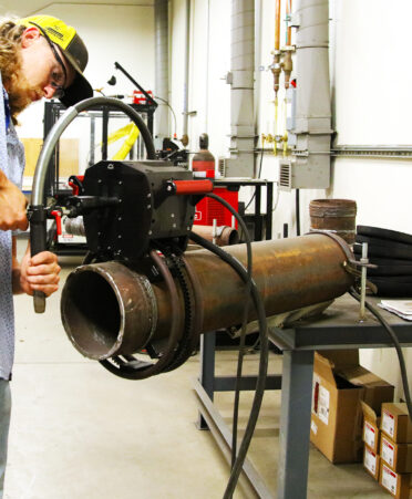 TSTC Welding Technology instructor Alex Deibert demonstrates some of the new equipment that the program received for its automation lab.