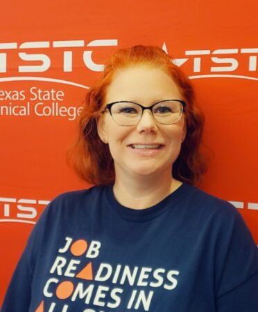 Jamie Jimenez stands against an orange TSTC background.