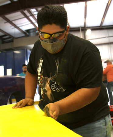 TSTC Auto Collision and Management Technology student and future SkillsUSA competitor Anthony Luna prepares a front-end section hood panel for a paint job on a 2004 Ford Focus. Among the SkillsUSA competitions in which TSTC students can compete are Auto Refinishing Technology and Collision Repair Technology.
