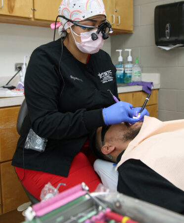 TSTC Dental Hygiene student Beyonce Cortez practices cleaning teeth on a fellow classmate as part of the hands-on training curriculum.