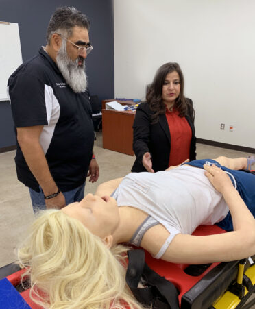 Oscar Cortez, (left), Texas State Technical College’s Emergency Medical Services program director, shows state Rep. Janie Lopez, (right), a medical manikin used by students in the program. Lopez toured TSTC’s Harlingen campus on Friday, March 10.