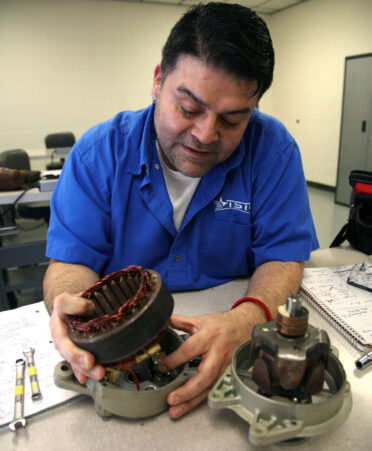 TSTC Aircraft Powerplant Technology student David Cortinas identifies the layers in an alternator of an aircraft engine during a recent lab session.