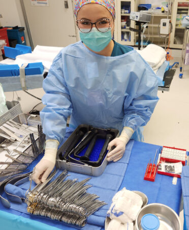 TSTC alumna Alejandra Rubio, a surgical technician for Rio Grande Regional Hospital, sterilizes surgical equipment for an implant-based reconstruction surgery.