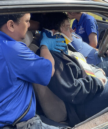 TSTC Emergency Medical Services student Joel Dacancy (left) helps Holley Carter, acting as a patient, during an Extrication Day event for EMT students on April 27. The students responded to a staged mass-casualty situation with the aid of first responders from Callahan and Taylor counties.