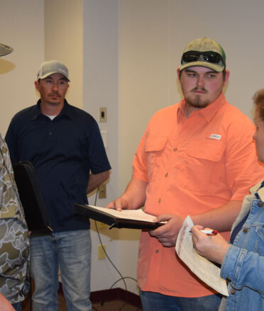 TSTC Diesel Equipment Technology students Hunter Sturguess (left) and Aaron Turnbough (second from right) discuss their resumes with Heather Bell (right), a talent acquisition analyst for CSI Compressco, following a recent employer spotlight. Also pictured is Cordon Johnson, a service manager for CSI Compressco.