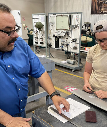 Willie Rodriguez (left), who teaches TSTC’s FAST Trac Airframe and Powerplant Workforce Training program, discusses measurements with student Sarah Penney. TSTC offers an Associate of Applied Science degree and certificates of completion in Aircraft Airframe Technology and Aircraft Powerplant Technology at the Abilene, Harlingen and Waco campuses.
