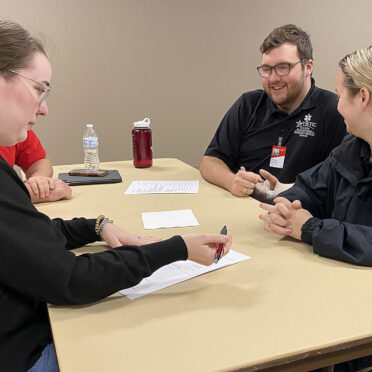 TSTC Advanced Emergency Medical Services students Dustin Bostick (second from right) and Mackenzie Brigman (right) receive resume tips from Erin Wilhite, a TSTC career services director in West Texas, following a job interview skills workshop in Brownwood.