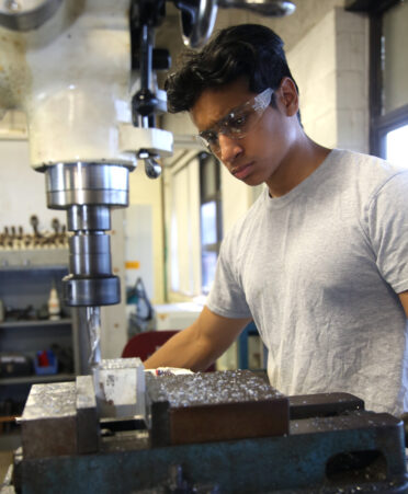 Damian Rangel, a senior from Lyford High School, squares an aluminum block using a mill machine in the Precision Machining Summer Camp hosted by TSTC’s Workforce Training and Continuing Education department at TSTC’s Harlingen campus.