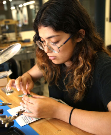 Mia Lara, a rising junior at San Benito High School, connects LED lights to a motherboard that will be used for a Bluetooth speaker in the Biomedical Equipment Technology program during TSTC’s MAARS summer program held at the Harlingen campus.