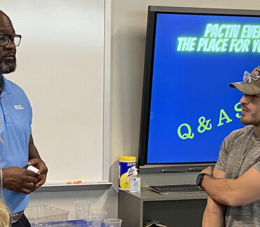 TSTC Industrial Systems student Arend Bali (right) talks with Pactiv Evergreen officials Julliana Delacot (left) and Brent Nealy following a recent employer spotlight.