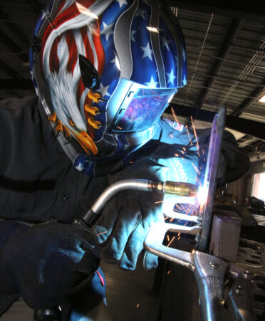 TSTC Welding Technology student Paulo Garza, of MIssion, welds a steel plate using a 3G uphill MIG weld during a lab session.