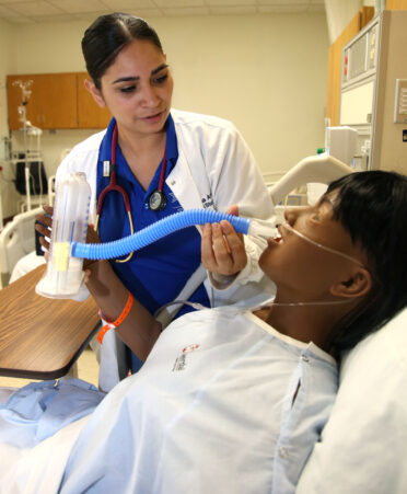 TSTC Vocational Nursing student Sonia Rios provides supplemental oxygen to a medical manikin while listening to lung sounds during a recent lab session.