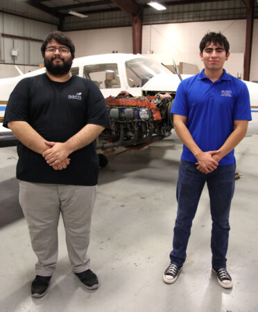TSTC Aircraft Powerplant Technology students Fernando Espinoza (left) and Abel Cazares recently were hired as full-time aircraft airframe and powerplant mechanics with Envoy Air.