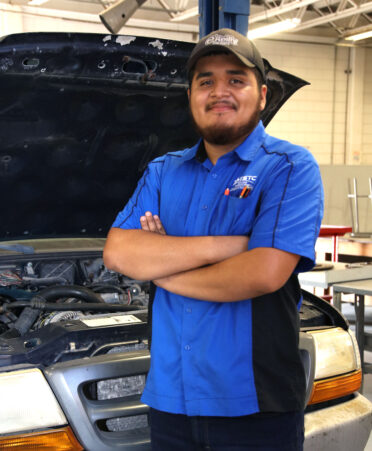 TSTC Automotive Technology student Jesus Quintero stands next to a 2000 Ford Ranger pickup truck in the automotive lab at TSTC’s Harlingen campus.
