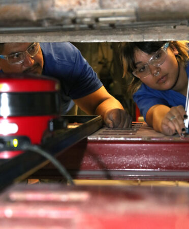 TSTC Auto Collision and Management Technology program director Jose Vasquez (left) explains how to do a target adjustment using a live mapping system to student Allison Agundiz during a recent lab session.