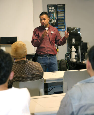 Raul Aleman, production manager for EPIC Piping, speaks with TSTC Welding Technology students about job opportunities available at EPIC Piping during a recent employer spotlight at TSTC’s Harlingen campus.