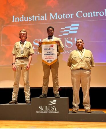 TSTC student Tristan Matthew (center) took first place in the 2023 SkillsUSA Texas Postsecondary Leadership and Skills Conference’s Industrial Motor Control competition earlier this year. (Photo courtesy of TSTC.)