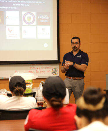 Aaron Garcia, director of business development and sales for Aveanna Healthcare, speaks with TSTC Nursing students about available job opportunities during a recent employer spotlight at TSTC’s Harlingen campus.