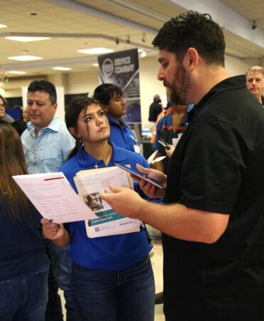 TSTC Aircraft Powerplant Technology student Olivia Montalvo visits with Aubrey Skalak (right), a facilities operations and maintenance manager for Texas Instruments, at the recent Industry Job Fair held at TSTC’s Harlingen campus.
