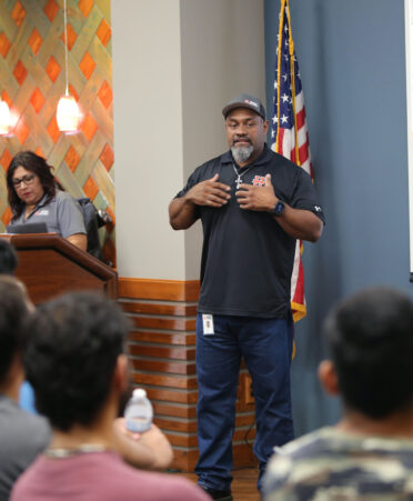 Dennis Norris (right), area construction manager for Morton Buildings Inc., speaks with TSTC Building Construction Technology students about available job opportunities during a recent employer spotlight at TSTC’s Harlingen campus.