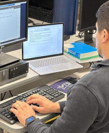 man sitting in front of computer