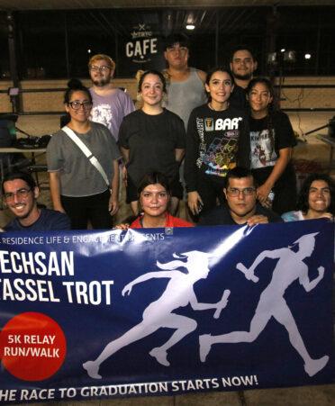 Some TSTC students celebrate the finish of the Techsan Tassel Trot, a 5K relay run/walk, outside the Student Center at TSTC’s Harlingen campus.