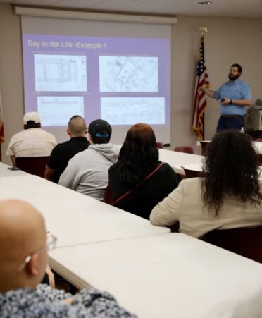Representatives from MTG Engineers & Surveyors present some of the company’s designs to TSTC Drafting and Design students during a recent employer spotlight. (Photo courtesy of TSTC.)