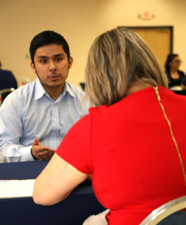 Simon Alcala (left), a TSTC Building Construction Technology student, discusses his job qualifications with Melinda Gonzales, program specialist for the San Benito CISD after-school program, during a recent TSTC Career Services Interview Practicum.