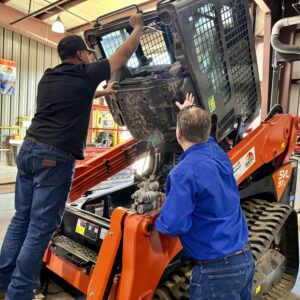 TSTC student John Castro (left) joined the Diesel Equipment Technology program after an automobile accident put his career in the oil fields on hold. (Photo courtesy of TSTC.)