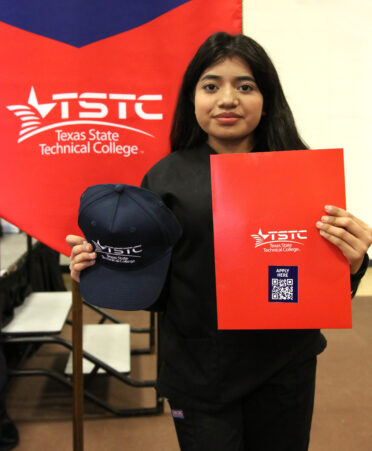 Nevaeh Cisneros, a senior from Harlingen High School, shows her TSTC pride after signing her letter of intent to pursue Vocational Nursing at TSTC during the recent National CTE Letter of Intent Signing Day at TSTC’s Harlingen location.