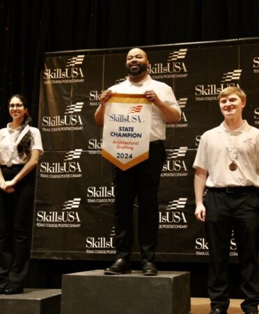 TSTC student Tarren Harvey (center) won the gold medal for Architectural Drafting at the 2024 SkillsUSA Texas Postsecondary State Leadership and Skills Conference. (Photo courtesy of TSTC.)