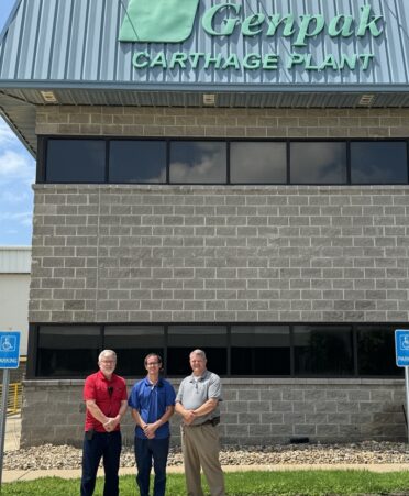 TSTC Industrial Systems graduate Hunter Burney (center) is the automation technician lead for Genpak's Carthage plant. Maintenance manager Hal Rymel (left) said he and plant manager Darin West (right) look for TSTC graduates like Burney who have electrical and mechanical backgrounds. (Photo courtesy of TSTC.)