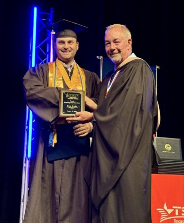 Electrical Lineworker and Management Technology graduate Jason Gryder (left) received the Provost’s Outstanding Achievement Award at the recent Summer 2024 Commencement. Presenting the award is Bart Day, provost of the Marshall campus. (Photo courtesy of TSTC.)