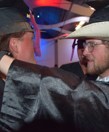 two men in hats during graduation