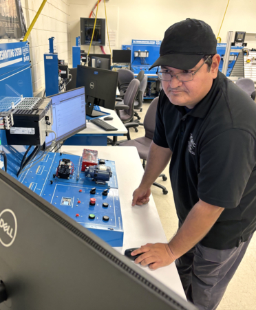 Eduardo Garcia, a TSTC Mechatronics Technology student at TSTC’s Harlingen campus, practices using a programmable logic controller to test for inconsistencies during a recent lab session.