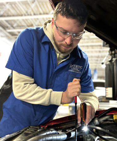 Gavin Almeida, an Automotive Technology student at TSTC’s Harlingen campus, removes a belt from a 1996 GMC Sonoma during a recent lab session.