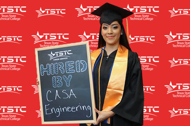 TSTC graduate posing in cap & gown holding a chalkboard showcasing their new employer.