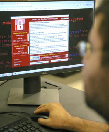 Gabriel Garcia, a Cybersecurity student at TSTC’s Harlingen campus, reviews a ransomware lecture during a recent lab session.